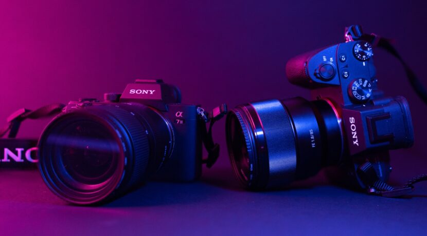black nikon dslr camera on blue surface