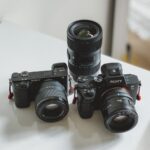 black nikon dslr camera on white table