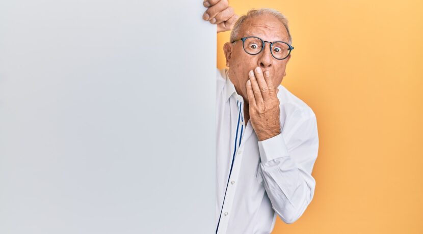man in white dress shirt wearing black framed eyeglasses