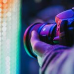 person holding DSLR camera