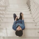 unknown person sitting on stair