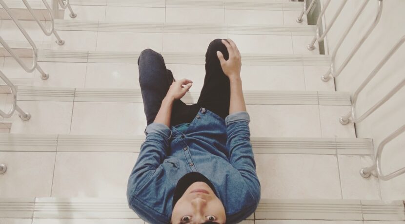 unknown person sitting on stair
