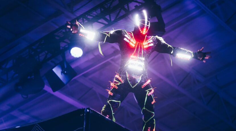 person wearing white and red LED light suit