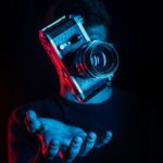 person holding DSLR camera