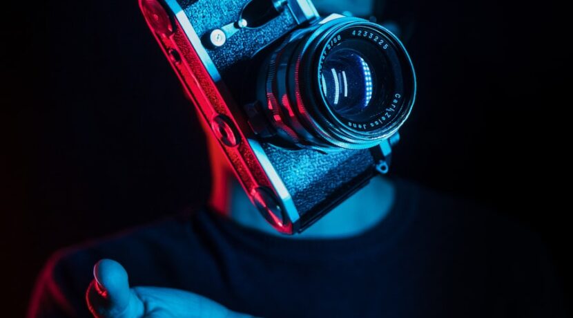 person holding DSLR camera