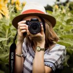 woman taking photo of plants