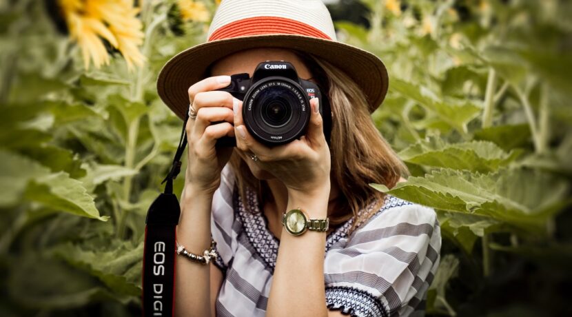woman taking photo of plants