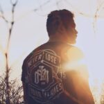 man standing near trees during daytime