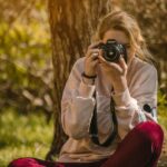 woman taking a photo during daytime