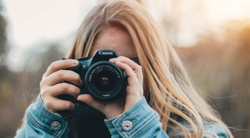 woman taking photo during daytime