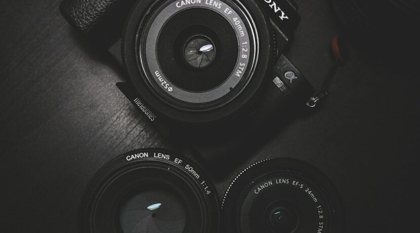 flat lay photography of black Sony DSLR camera on black surface