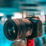 black nikon dslr camera on red stand