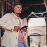 a man holding a tablet