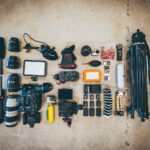 flat lay photo of camera gear on floor