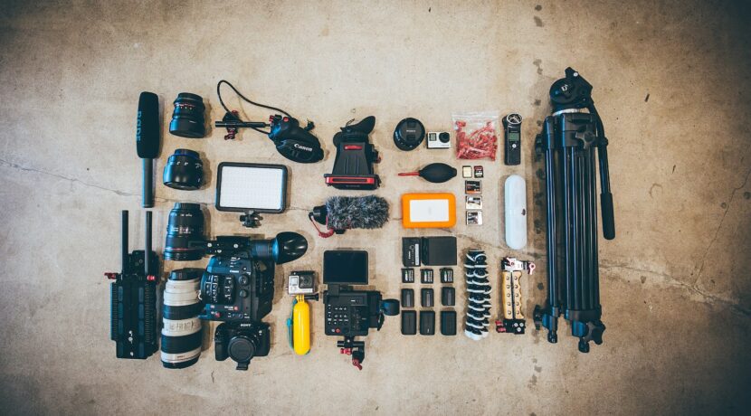 flat lay photo of camera gear on floor