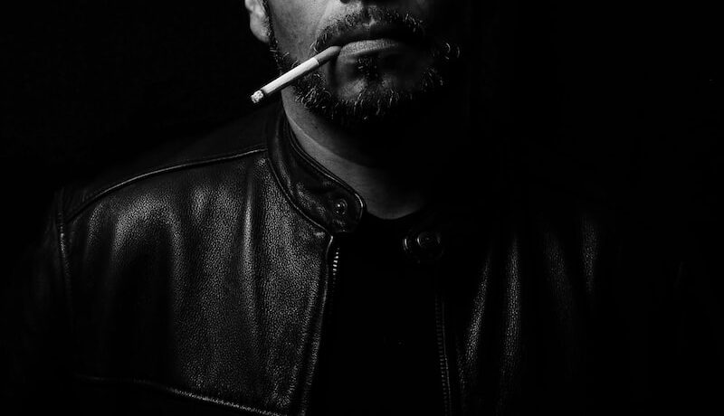 man wearing black leather jacket