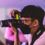 a man taking a picture with a camera