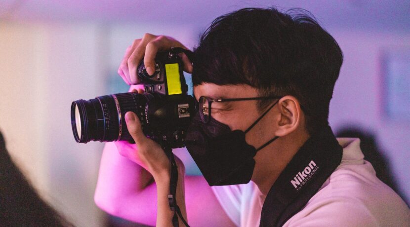 a man taking a picture with a camera