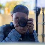 a man taking a picture of himself with a camera