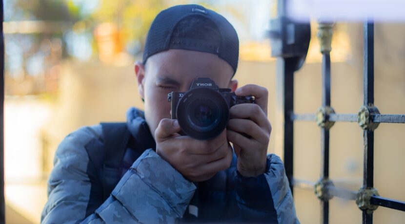 a man taking a picture of himself with a camera
