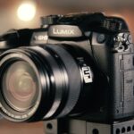 bokeh photography of black Lumix DSLR camera