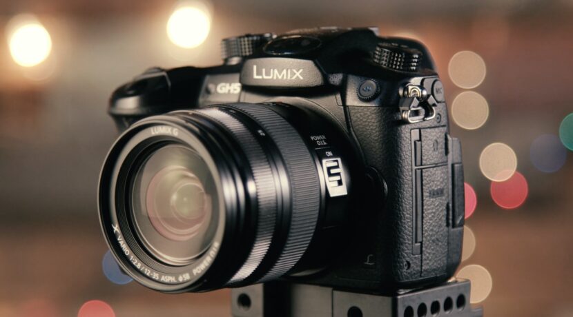 bokeh photography of black Lumix DSLR camera