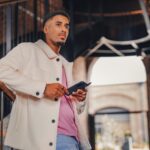 a man holding a tablet