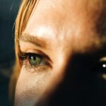 a close up of a person's eye with a blurry background