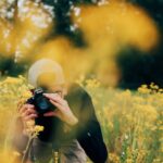 man using Nikon DSLR camera