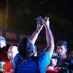 a man taking a picture of a group of people