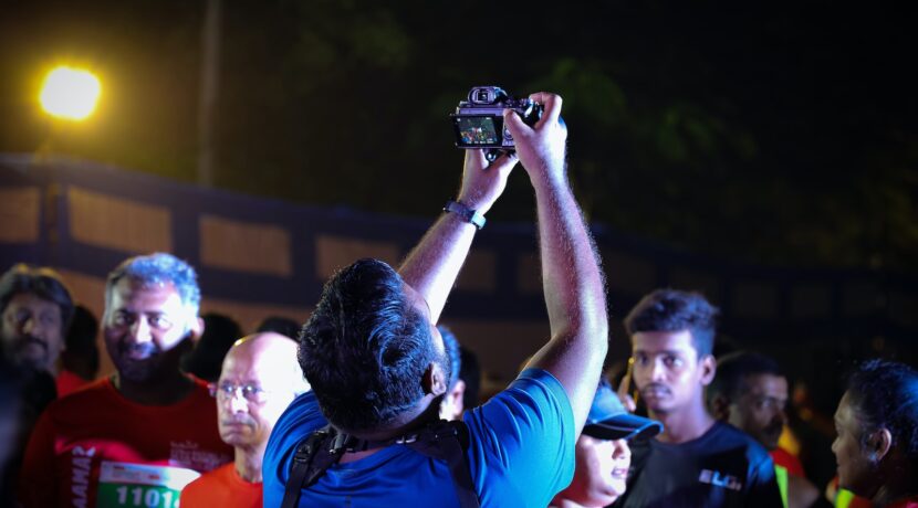 a man taking a picture of a group of people