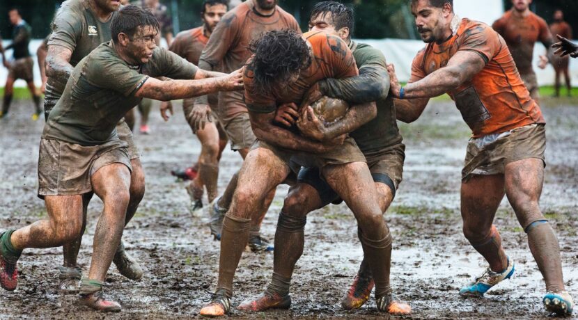 a group of men playing a game of rugby