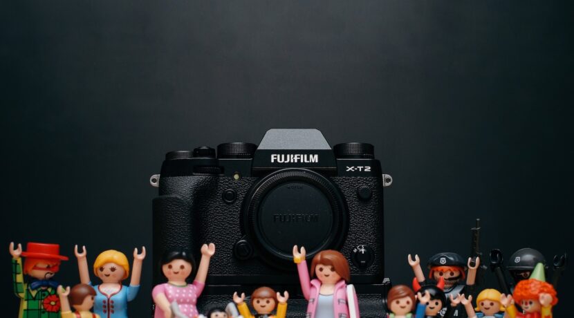 black Fujifilm camera body with minecraft toy lot