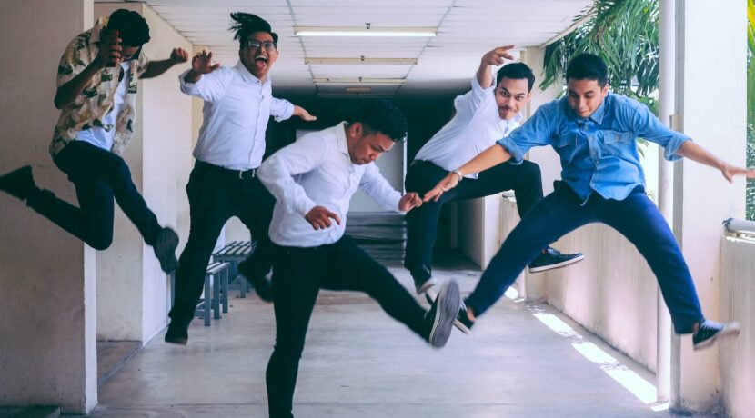 group of people doing jump shot photography