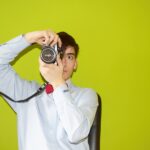 man holding DSLR camera