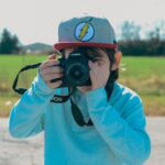 a person taking a picture with a camera