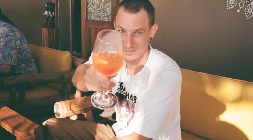 a man holding a glass of wine