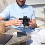 a man holding a camera