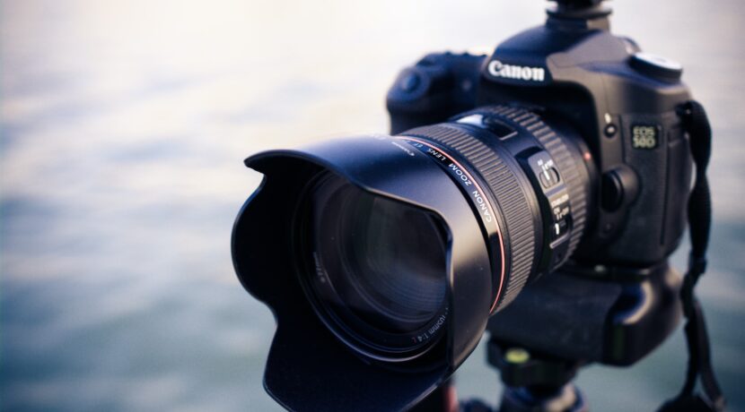 shallow focus photography of black Canon DSLR camera