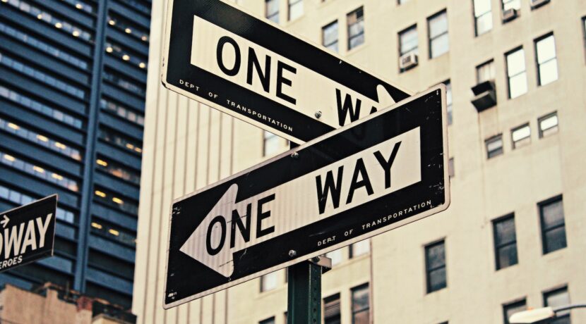 white and black One Way-printed road signages