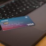 blue and white visa card on silver laptop computer