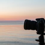 photo black DSLR camera on tripod