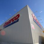 a large white building with a red and blue sign on it