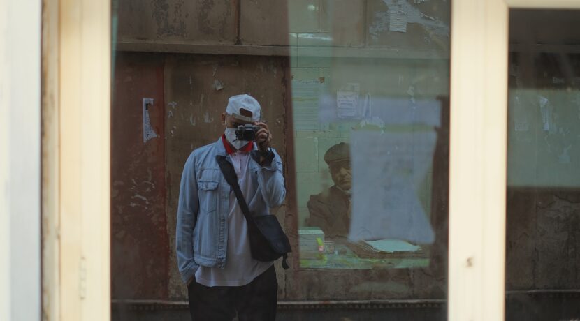 a man taking a picture of himself in a mirror