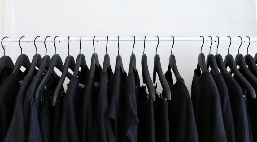 black clothes hanged in rack