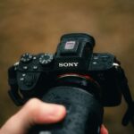 a person holding a camera up to take a picture