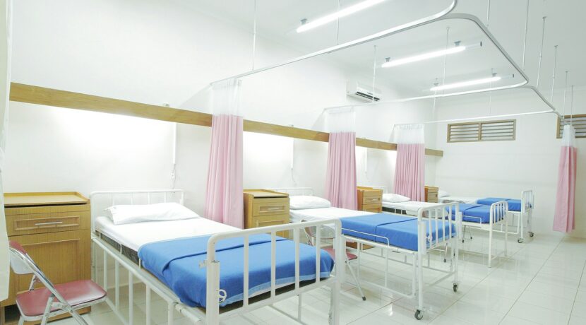 empty hospital bed inside room