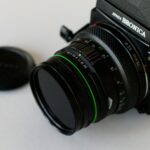 black nikon dslr camera on white table