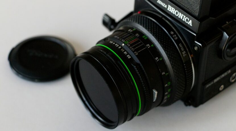 black nikon dslr camera on white table