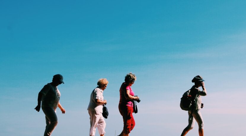 four people walking